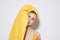 woman with yellow towel on her head bare shoulders fruit orange vitamin