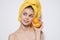 woman with yellow towel on her head bare shoulders fruit orange vitamin