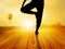 Woman yoga exercise in sunrise, soft and blur concept