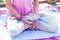 Woman in yoga meditation position  outdoor spring summer day close up of lower body hands  hold magnolia flower