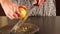 Woman zesting lemon at home closeup