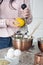 Woman zesting a lemon in the kitchen