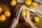 Woman zesting lemon at wooden table, top view