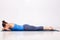 Womand relax in Hatha yoga asana Makarasana