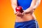 Womanin sportswear holding an apple. People, fitness and healthcare concept