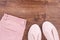 Womanly pink leather shoes and pants, copy space for text on rustic board