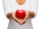 Womans cupped hands showing red heart