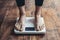 Womans feet on weight scale, health monitoring, fitness progress