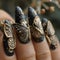 Womans fingers adorned with black and gold butterfly nail art