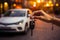 A womans hand grips a car key, ready to start a new car, while the background car park blurs