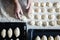 Womans hands rolling the dough for pies. Baking at home