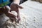 Womans hands rolling the dough for pies. Baking at home