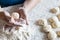 Womans hands rolling the dough for pies. Baking at home