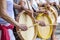 Womans percussionists playing drums during folk samba performance