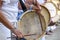 Womans percussionists playing drums during folk samba performance o