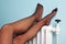 Womans stocking legs on a radiator