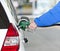 Womanâ€™s Hand Pumping Gasoline