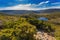 Wombat Pool surrounded by green mountains at Cradle mountain, La