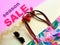 Women  accessories summer  big sale season  handbag sunglass wallet colorful red green lilac background