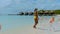 women at Aruba beach with pink flamingos at the beach, flamingo beach in Aruba Island Caribbean