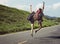 Women Backpacker Jumping on The Street