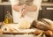 Women baker hands mixing recipe kneading butter, tomato preparation dough and making bread