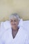 Women In Bathrobe Relaxing On Lounge Chair