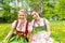 Women in Bavarian clothes or dirndl on a meadow