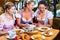 Women in Bavarian pub eating food for dinner