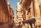 Women on beautiful narrow street with old haveli houses, historical indian homes