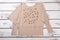 Women beige sweater with long sleeves.