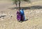 Women belonging to tribes of Maasai walking in the bush