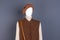 Women brown wool beret and waistcoat.