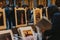 Women browse posters at second hand book market in the courtyard of the Vieille Bourse old stock exchange in Lille, France.