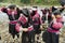 Women brush and style hair in Longji, China.