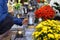 Women at the cemetery puts a candle on the grave