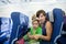 Women with child in airplane cabin