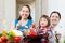 Women with child cooking veggie lunch