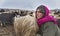 Women and children wake up in the morning to milk sheep, goats and yaks in very heavy snow conditions and very low temperatures at