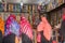 Women choose fabrics in a street shop. Traditional African textiles