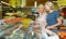 Women choosing frozen meat