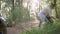 Women are collecting waste in forest in summer day, volunteer environmental movement for caring nature