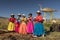 Women in colorful clothes. Titicaca lake. Peru.