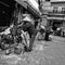 Women in conical hats collecting recycling with bicycles Vietnam