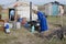 Women cook in front of the yurt entrance circa Harhorin, Mongolia.