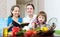 Women cook vegetables in the kitchen