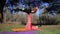 Women couple practicing acroyoga in the park at sunset