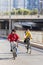 Women cycle in Beijing suburb on a sunny day, China