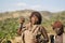 Women dance and sing at the bull jumping ceremony, Ethiopia