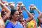 Women devotees carry scared pots in their heads and participates in the Thaipusam festival